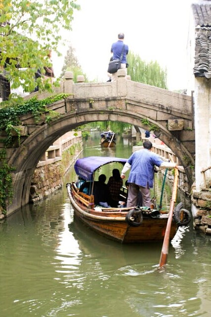 A Boat Going Under a Bridge in Zhouzhuang 周庄