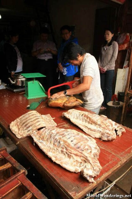 Carving Up Meat at the Market at Lijiang Ancient Town 丽江古城
