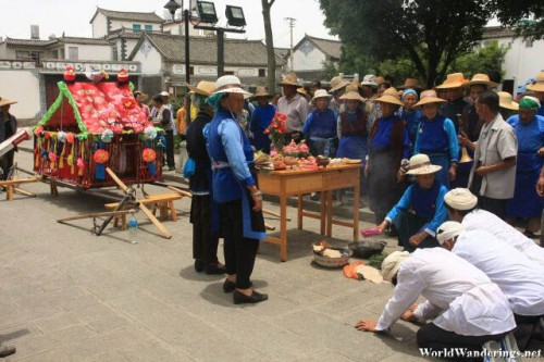Men Bowing at a Procession in Dali Ancient Town 大理古城