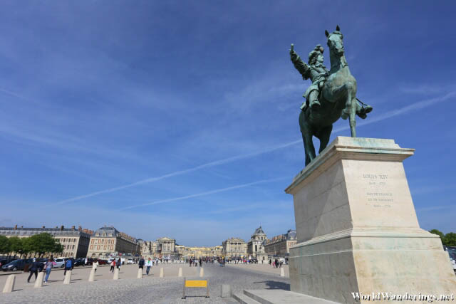 Statue of King Louis XIV in front of the Palace of Versailles