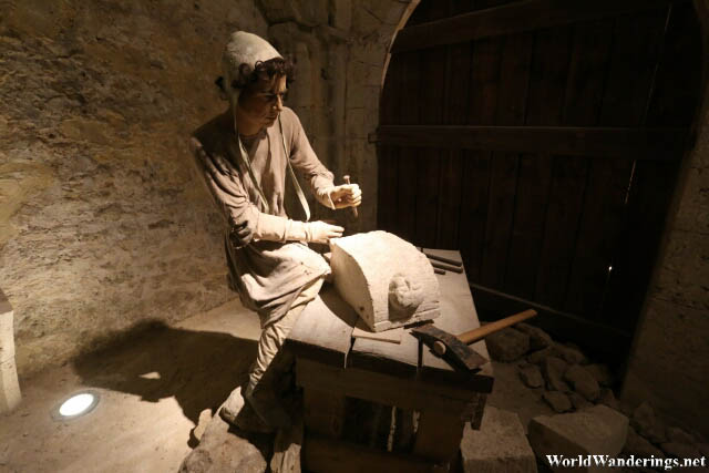 Stone Cutter at the Tithe Barn in the Medieval Town of Provins