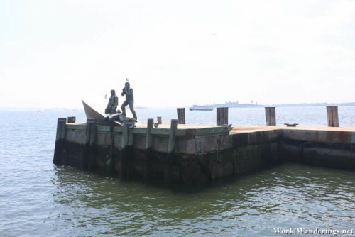 Statues at a Pier Near the Statue of Liberty Tour Entrance
