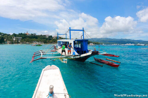 Transferring Good Via Motorized Outrigger Canoe at Boracay